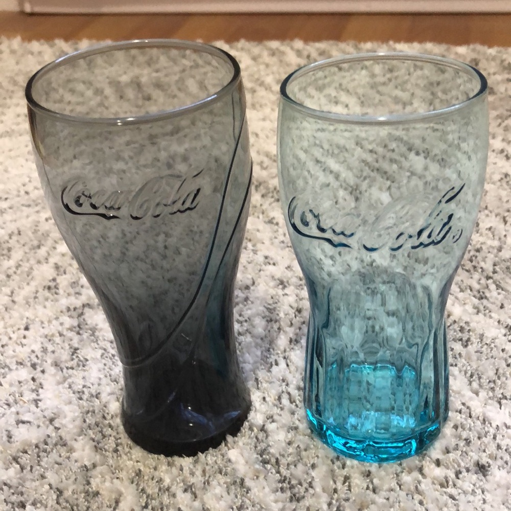 assorted Coca-Cola glasses